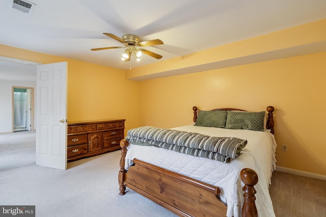 bedroom with light colored carpet and ceiling fan