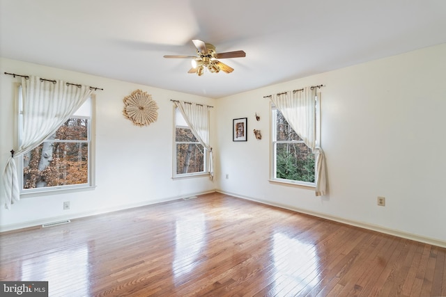 empty room featuring ceiling fan and wood-type flooring