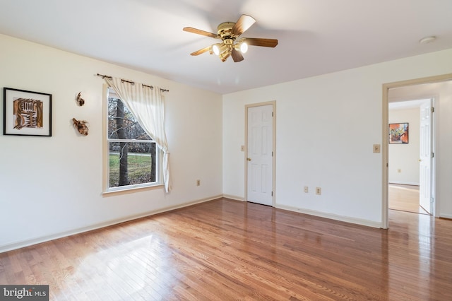 unfurnished room featuring ceiling fan and light hardwood / wood-style floors