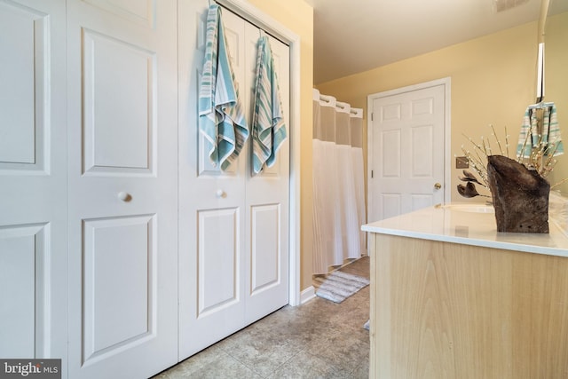 bathroom with tile patterned flooring and sink