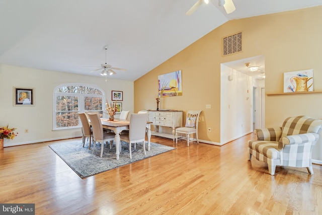 dining space featuring ceiling fan, light hardwood / wood-style flooring, and lofted ceiling