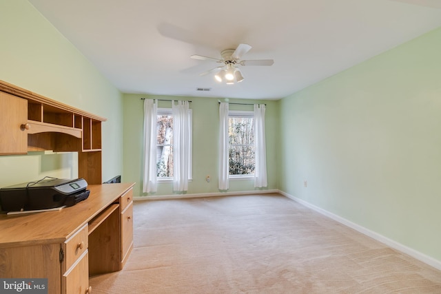 unfurnished office with light carpet and ceiling fan