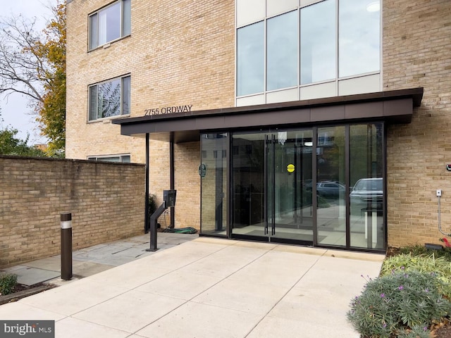 doorway to property with a patio area