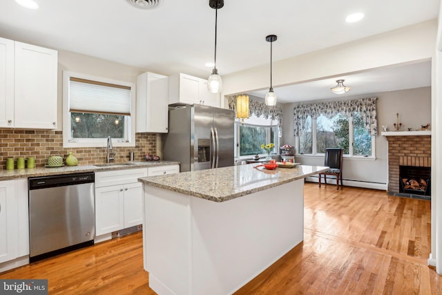 kitchen with white cabinetry, sink, and appliances with stainless steel finishes