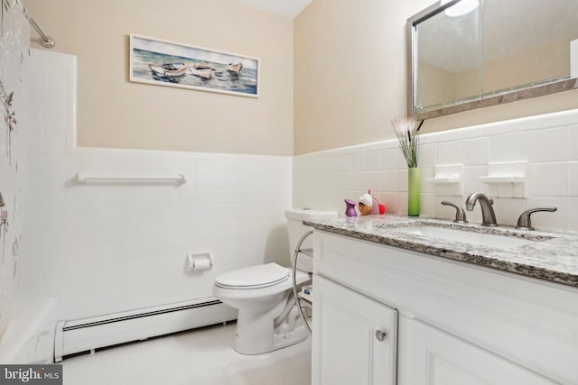 bathroom featuring walk in shower, a baseboard heating unit, toilet, vanity, and tile walls