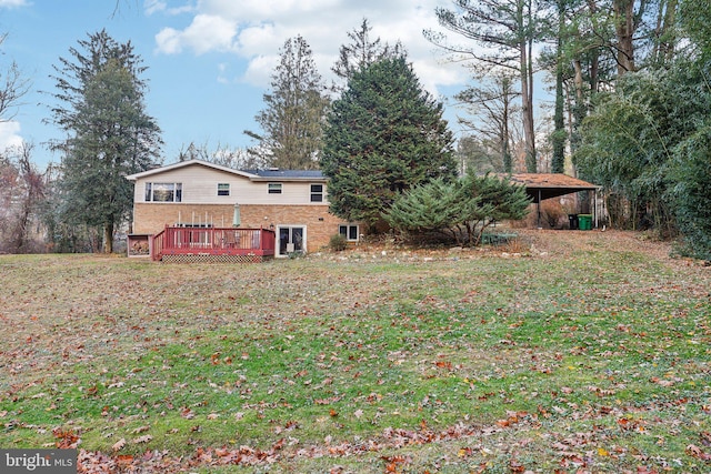 exterior space featuring a yard and a wooden deck