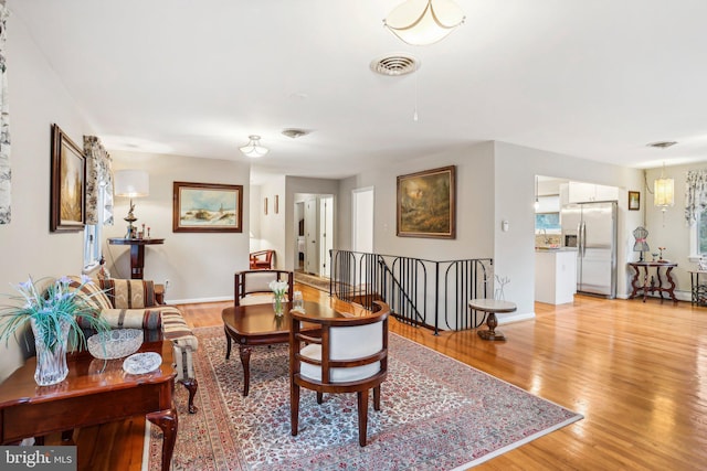 living room with light hardwood / wood-style flooring