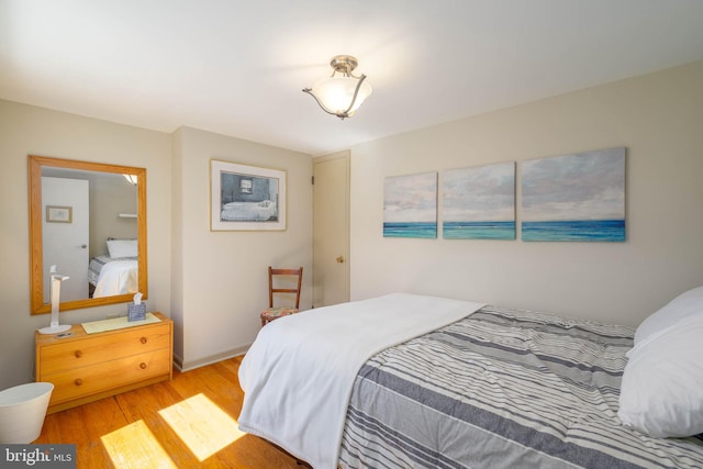 bedroom with light wood-type flooring