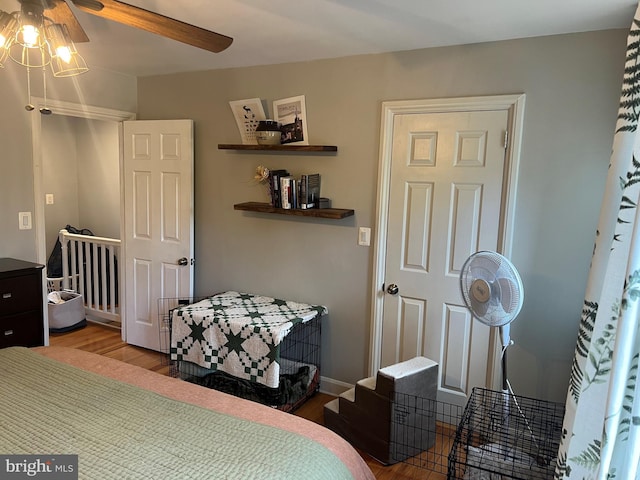 bedroom featuring hardwood / wood-style flooring and ceiling fan