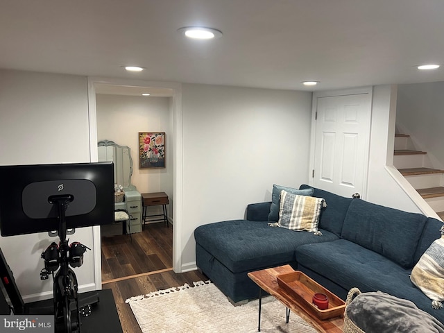 living room with dark hardwood / wood-style flooring