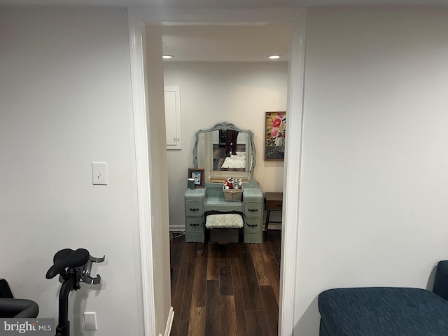 hallway with dark hardwood / wood-style floors