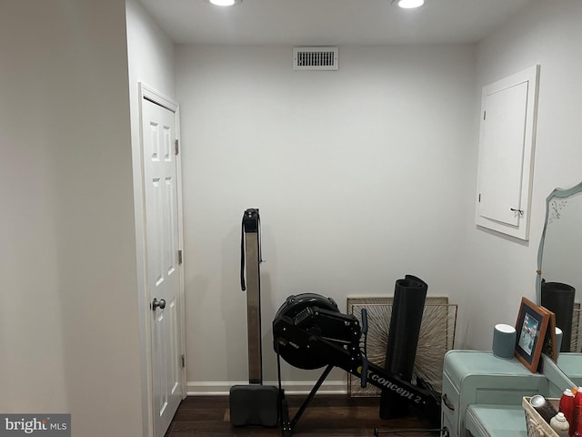 workout room with dark hardwood / wood-style floors