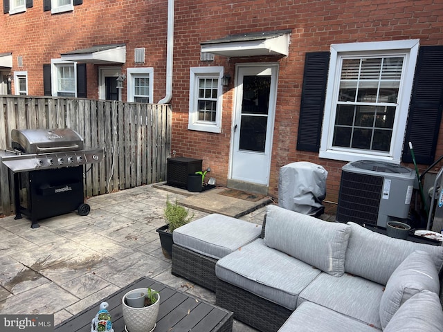 view of patio / terrace with a grill, an outdoor hangout area, and central AC