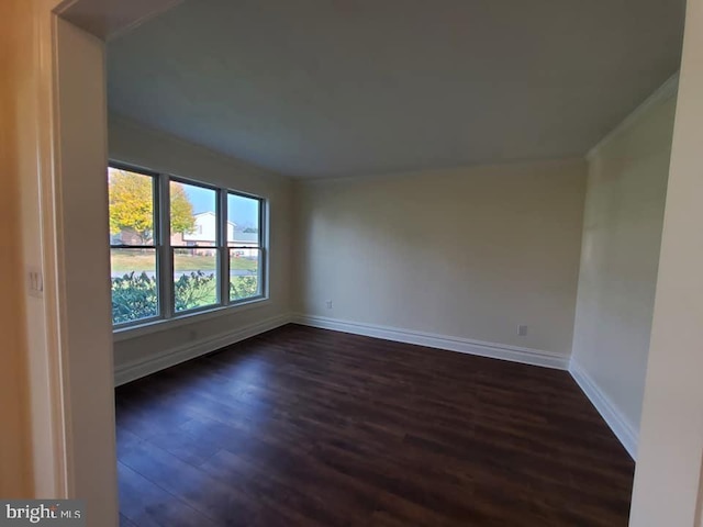 empty room with dark hardwood / wood-style floors