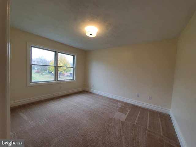 unfurnished room featuring carpet floors