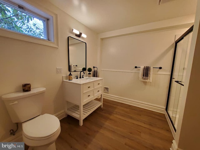 bathroom featuring vanity, toilet, and wood-type flooring