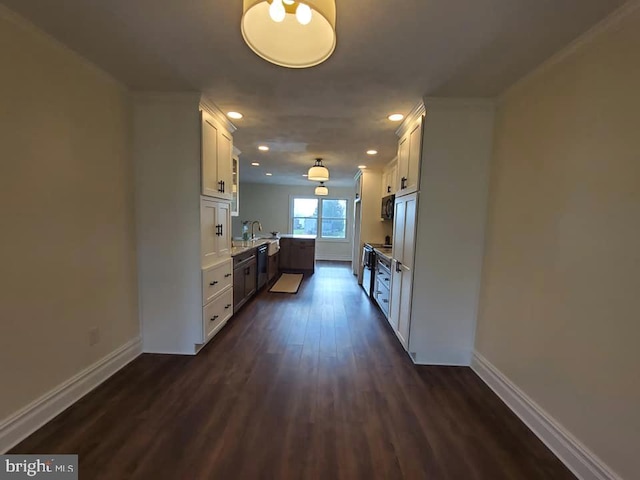 kitchen featuring sink, white cabinets, black appliances, and dark hardwood / wood-style floors