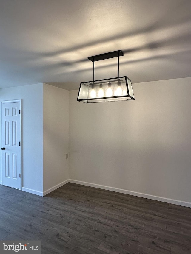 unfurnished dining area with dark hardwood / wood-style floors