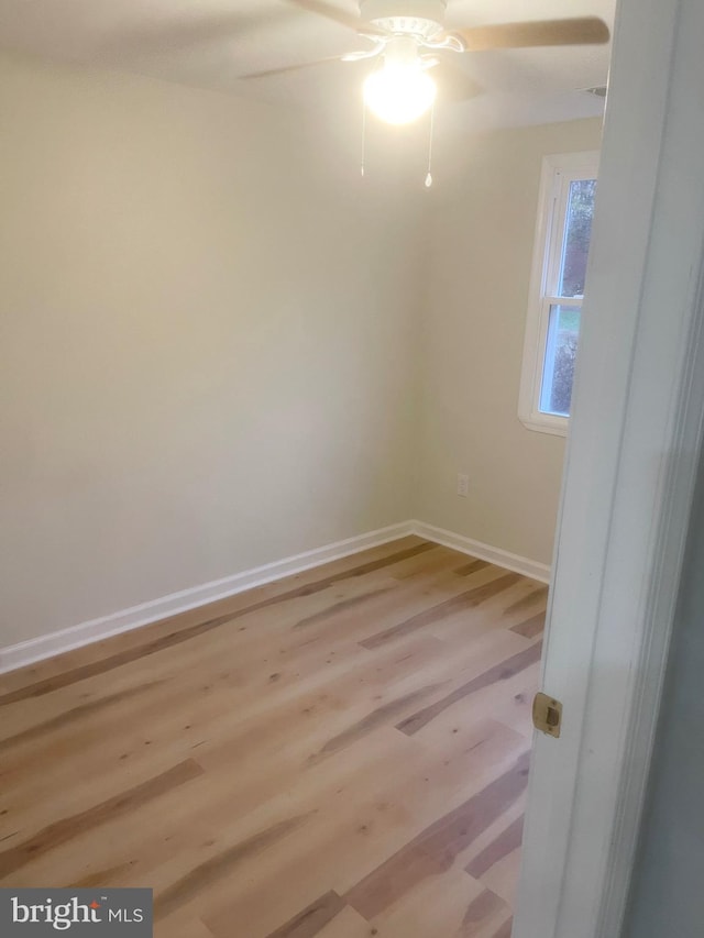 empty room with light hardwood / wood-style floors