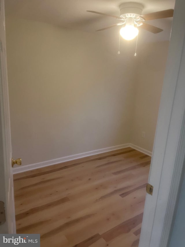 empty room featuring light hardwood / wood-style flooring and ceiling fan