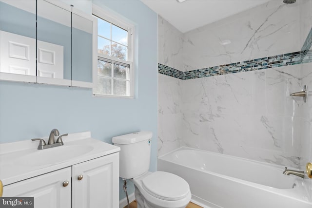 full bathroom with vanity, toilet, and tiled shower / bath combo