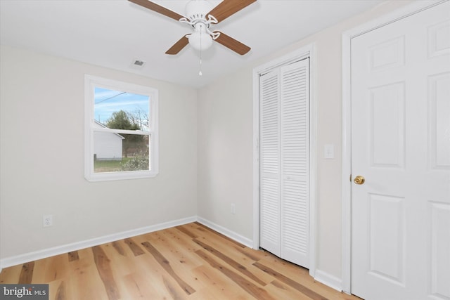 unfurnished bedroom featuring ceiling fan and light hardwood / wood-style flooring