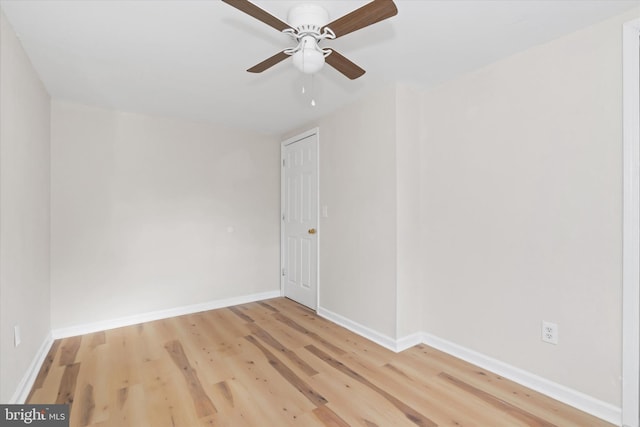 spare room featuring ceiling fan and wood-type flooring