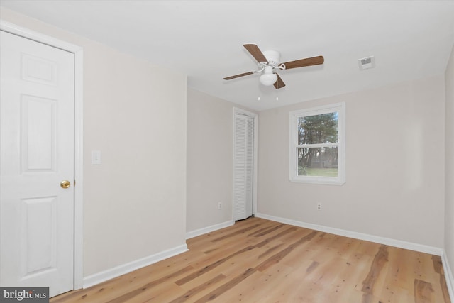 spare room with ceiling fan and light hardwood / wood-style floors