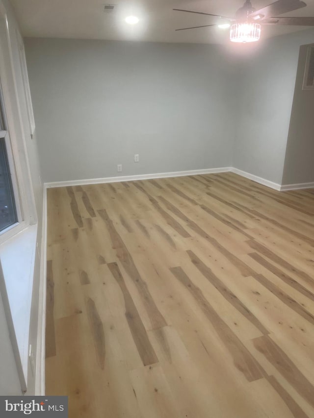 empty room with light hardwood / wood-style flooring