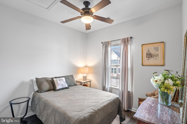 bedroom with ceiling fan and dark hardwood / wood-style flooring