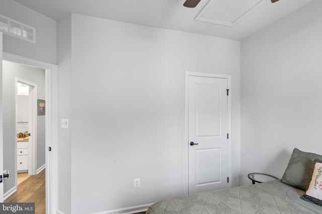 bedroom with light hardwood / wood-style flooring and ceiling fan