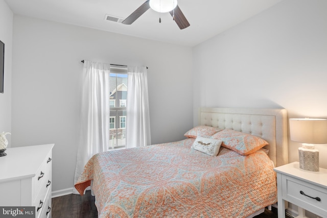 bedroom featuring dark hardwood / wood-style flooring and ceiling fan