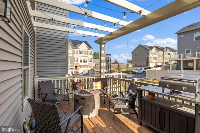 deck featuring a pergola and grilling area