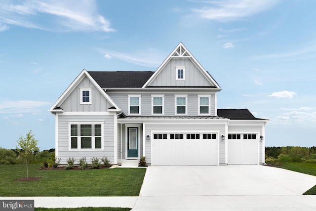 craftsman-style home with a garage and a front lawn