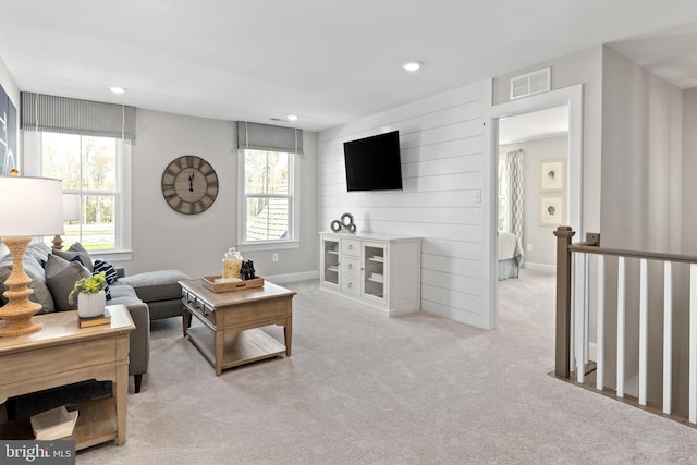 carpeted living room with plenty of natural light