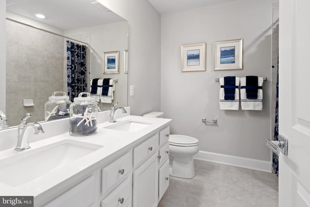 bathroom with tile patterned flooring, vanity, toilet, and curtained shower