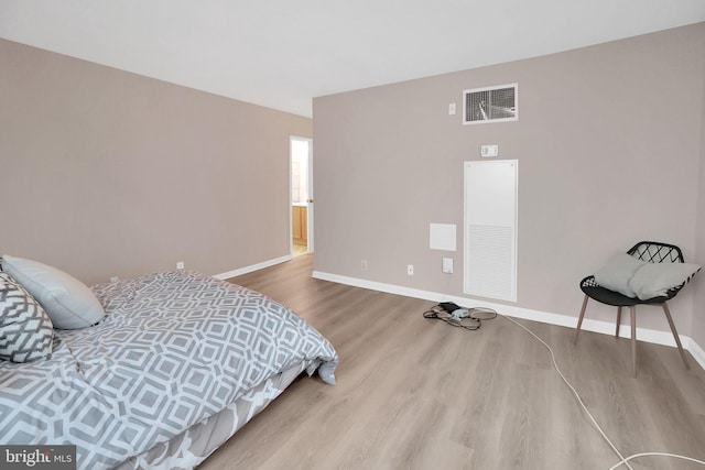 bedroom with wood-type flooring