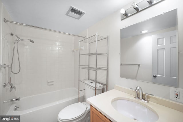 full bathroom featuring vanity, toilet, and tiled shower / bath combo