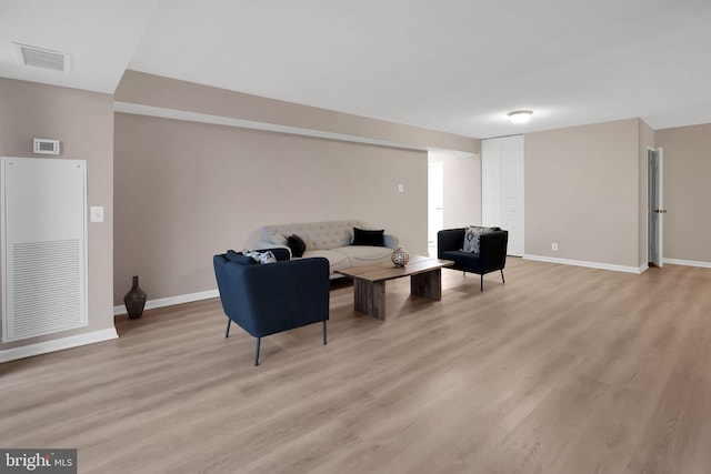 sitting room with light hardwood / wood-style floors