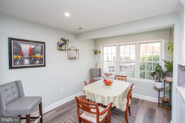 dining room with dark wood-type flooring