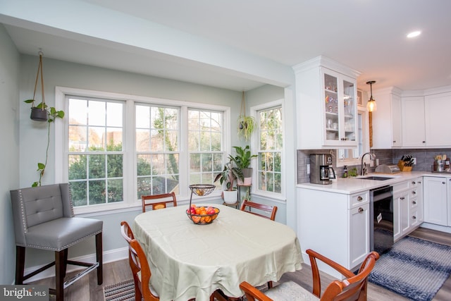 dining area featuring hardwood / wood-style floors and sink