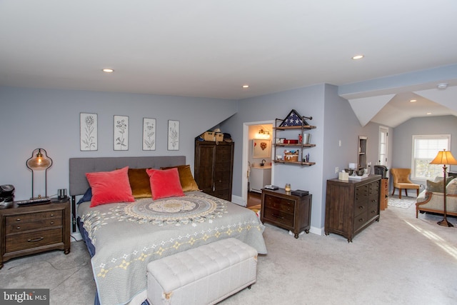 carpeted bedroom with vaulted ceiling