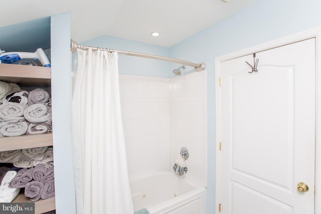 bathroom with shower / bath combo with shower curtain