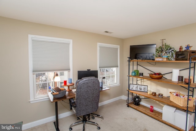 office featuring light colored carpet and a wealth of natural light