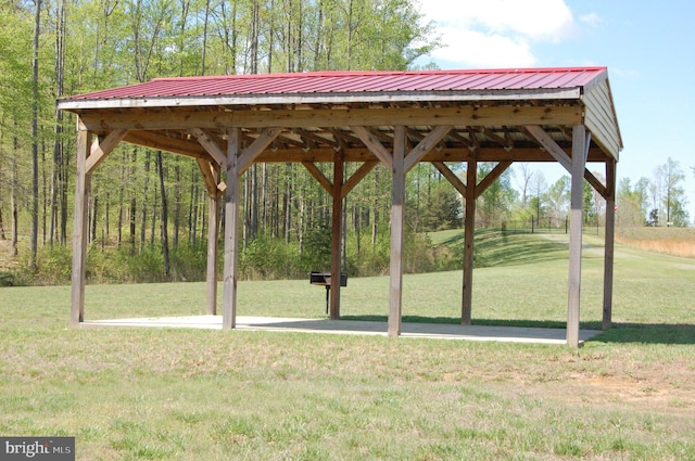 view of property's community with a gazebo and a yard