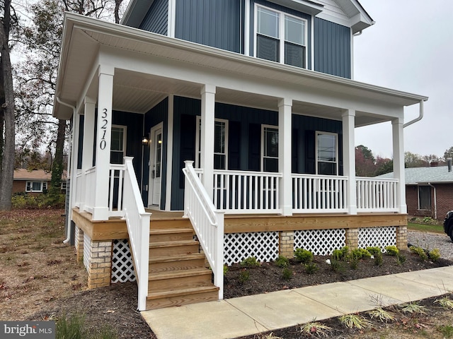 view of front of house featuring covered porch and board and batten siding