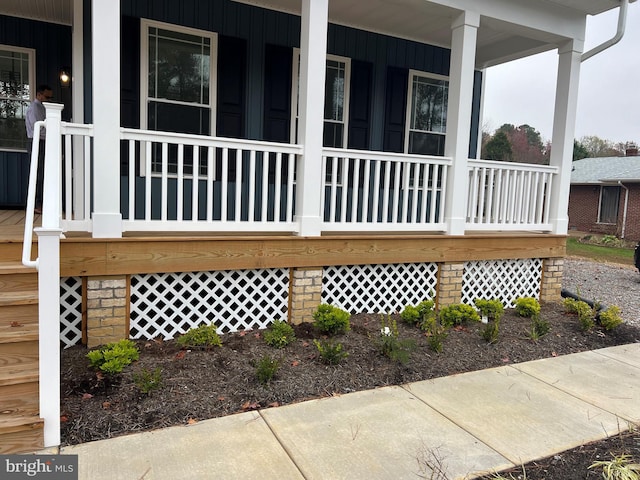 view of property exterior featuring a porch