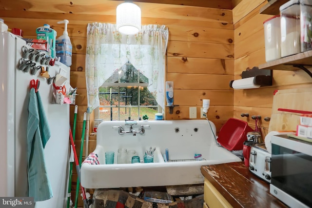 miscellaneous room featuring wood walls