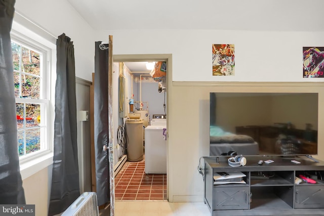 hallway with radiator heating unit and separate washer and dryer