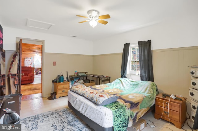 bedroom with ceiling fan and light hardwood / wood-style floors